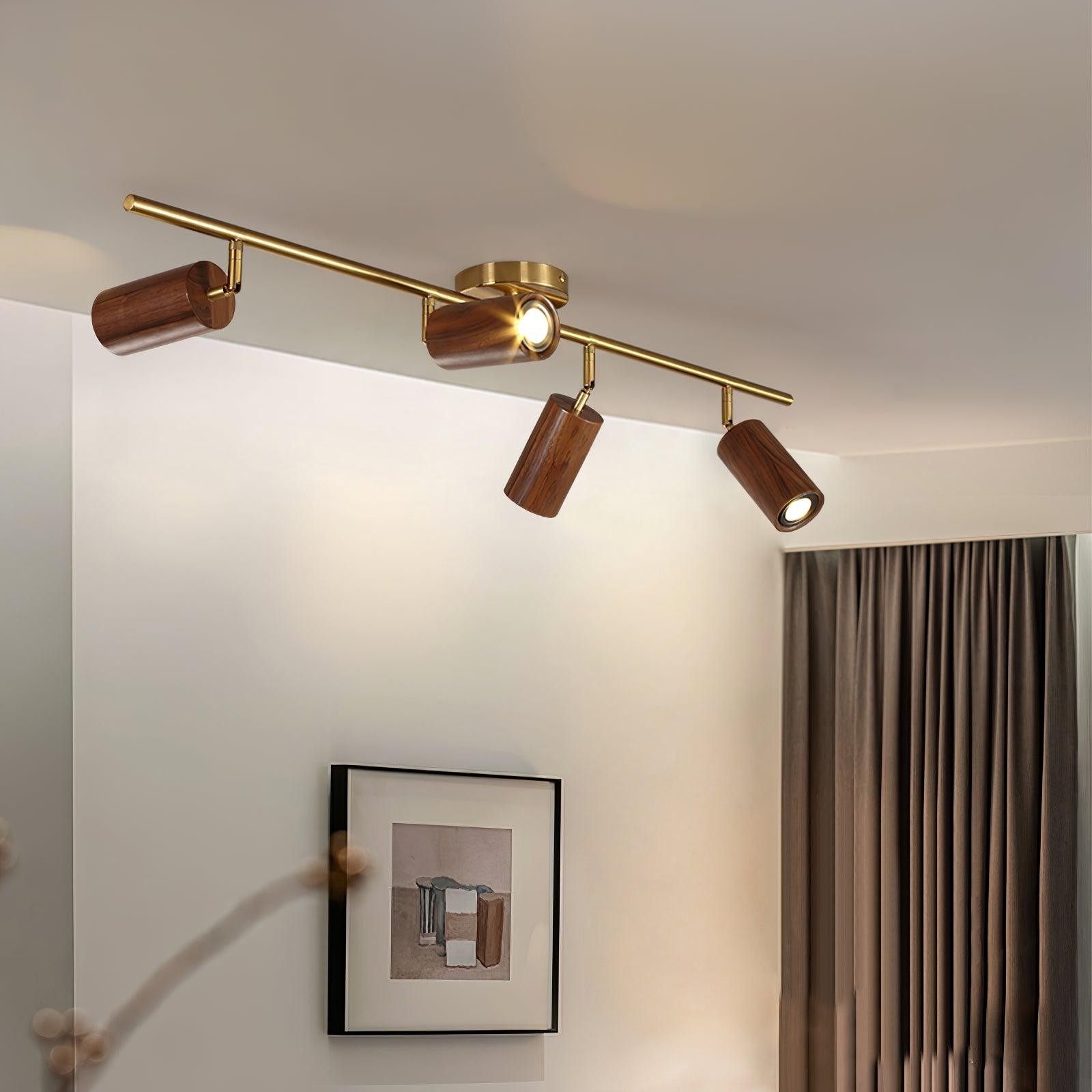 Four-head wooden track light installed in a calm living room scene