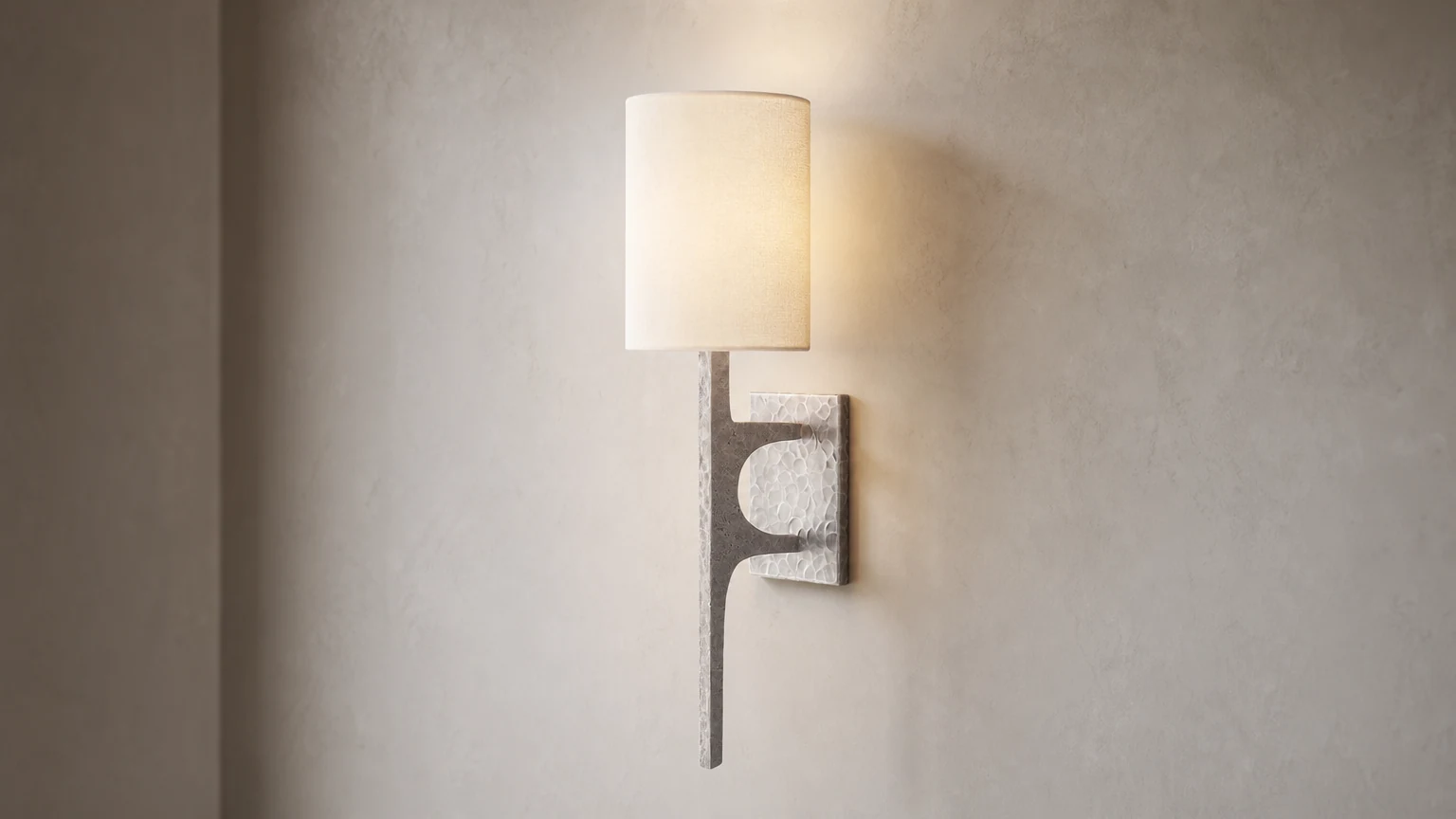 Texturoc Linear Wall Light shown as a modern hammered wall sconce in a room setting
