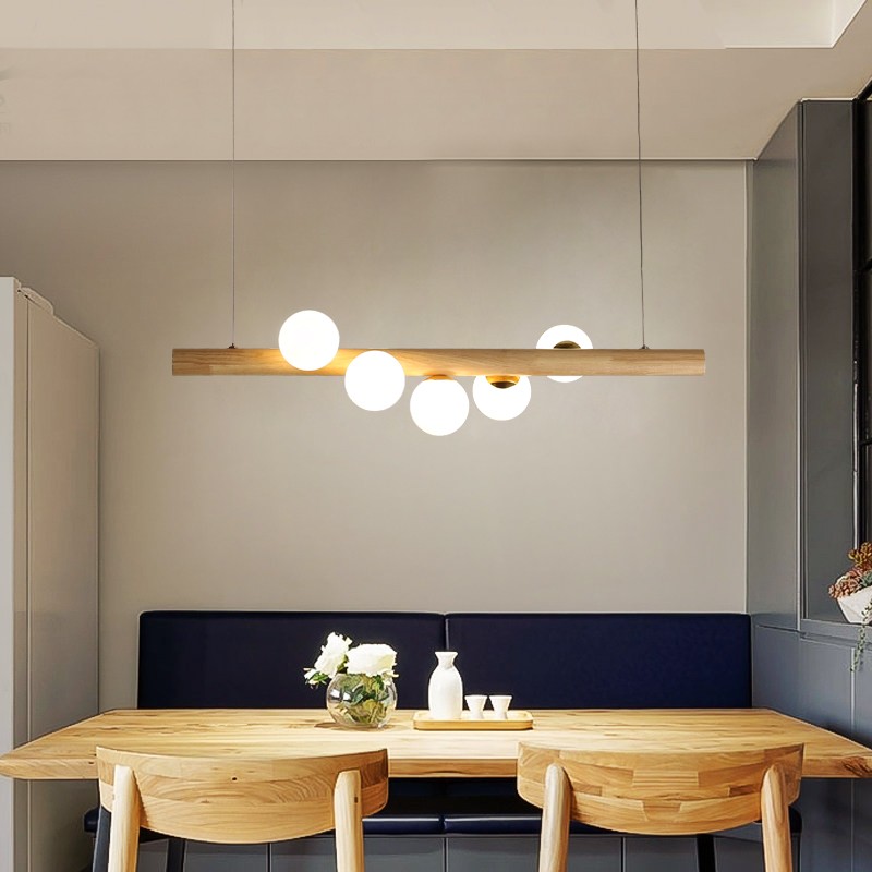 Lampa wisząca Dot Line w jadalni z szafkami ściennymi