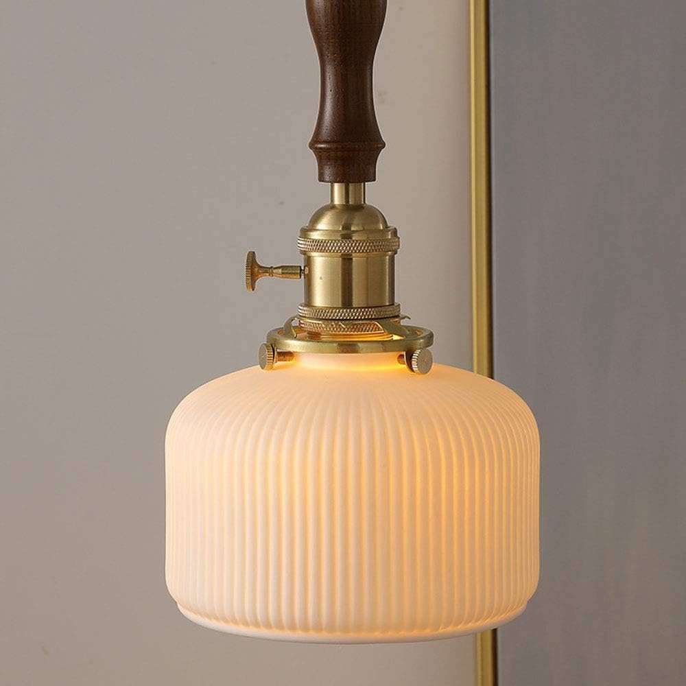 Close-up of ceramic shade and wood hanging detail on the pendant lamp