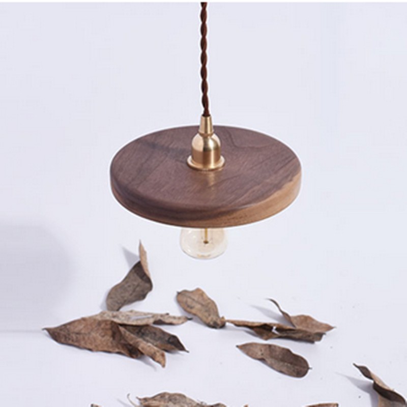 Wooden Pendant Light styled with leaves