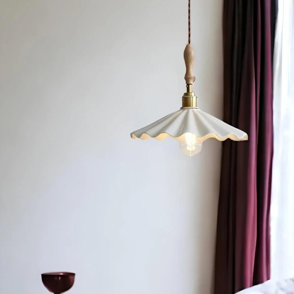 Ceramic Flute Pendant Lamp in a lifestyle setting near curtain and wall