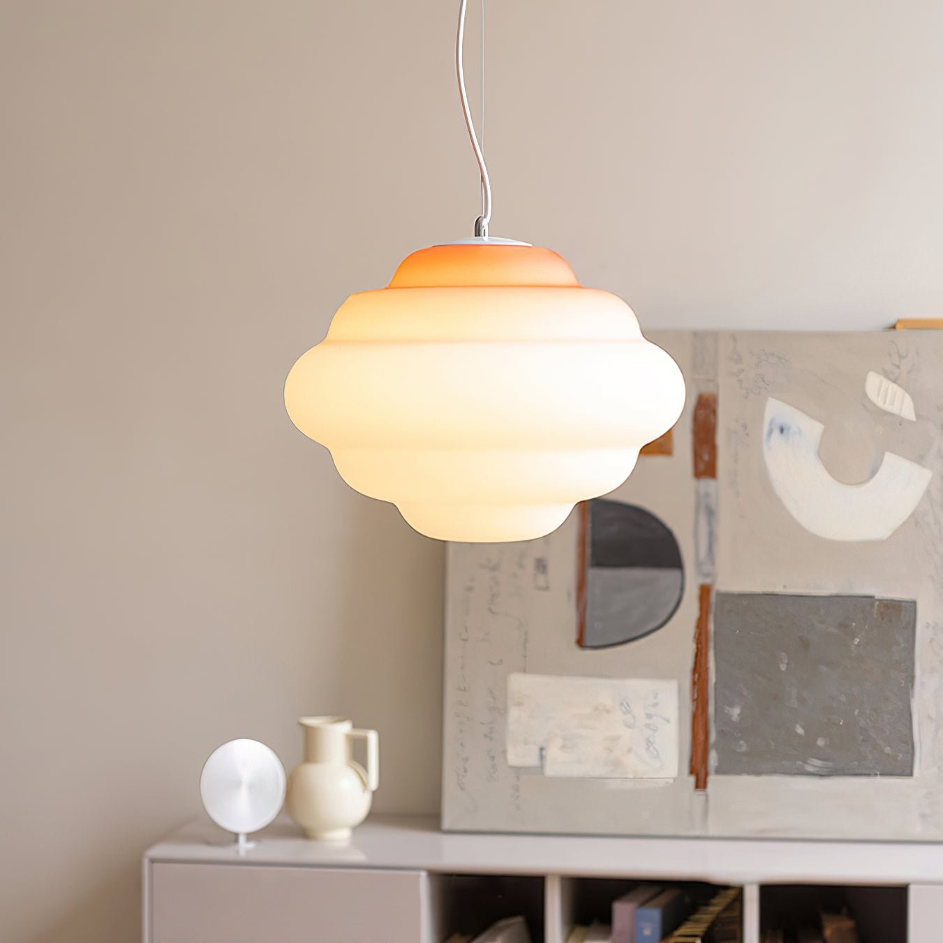 Orange gradient cloudy pendant above furniture