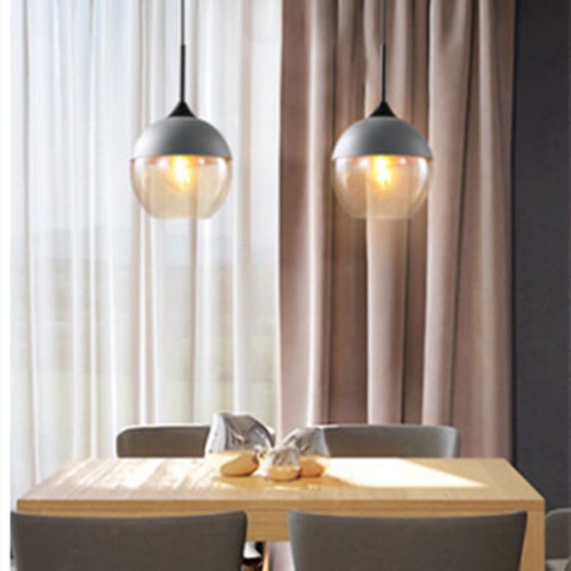 Two SOMMELIER pendant lamps above a dining table