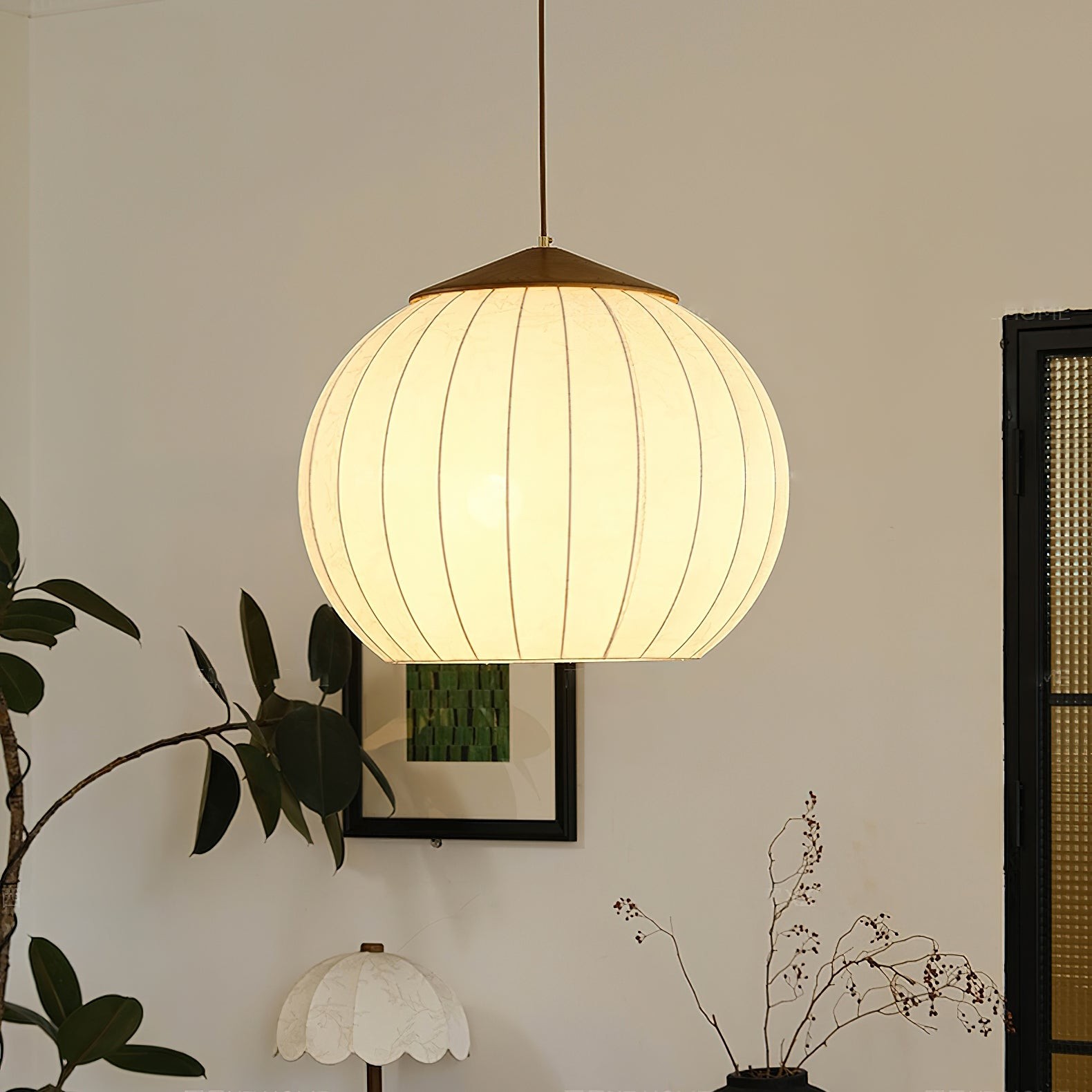 Large illuminated fabric lantern pendant prominently framed