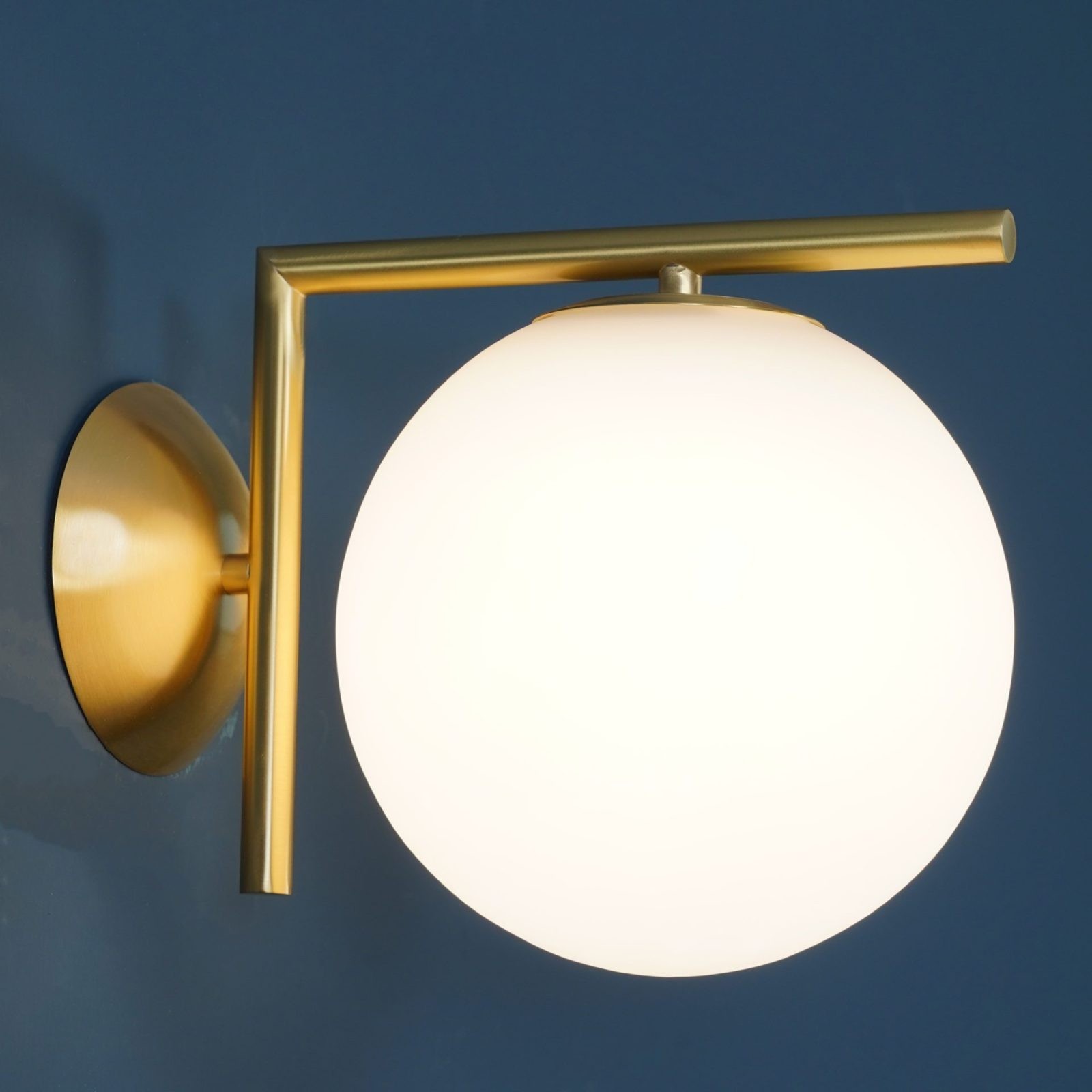 Close-up of illuminated brass glass globe light