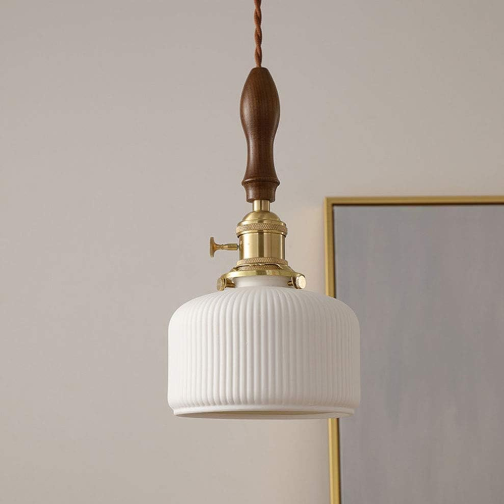 The Smooth Ceramic Pendant Lamp D863 shown unlit in a room setting
