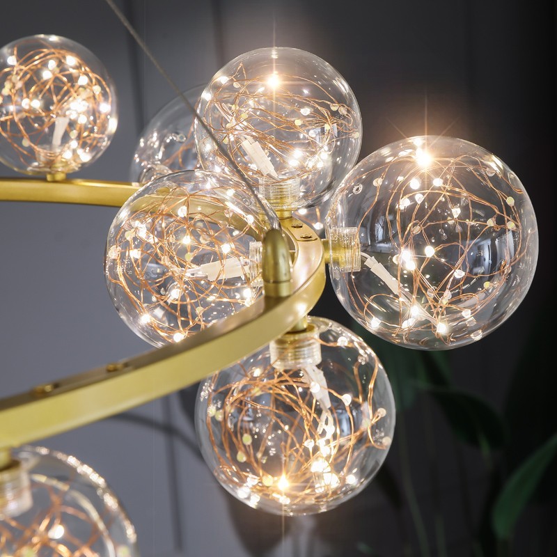 Close-up of Starry Ball Chandelier glass balls and gold metal ring