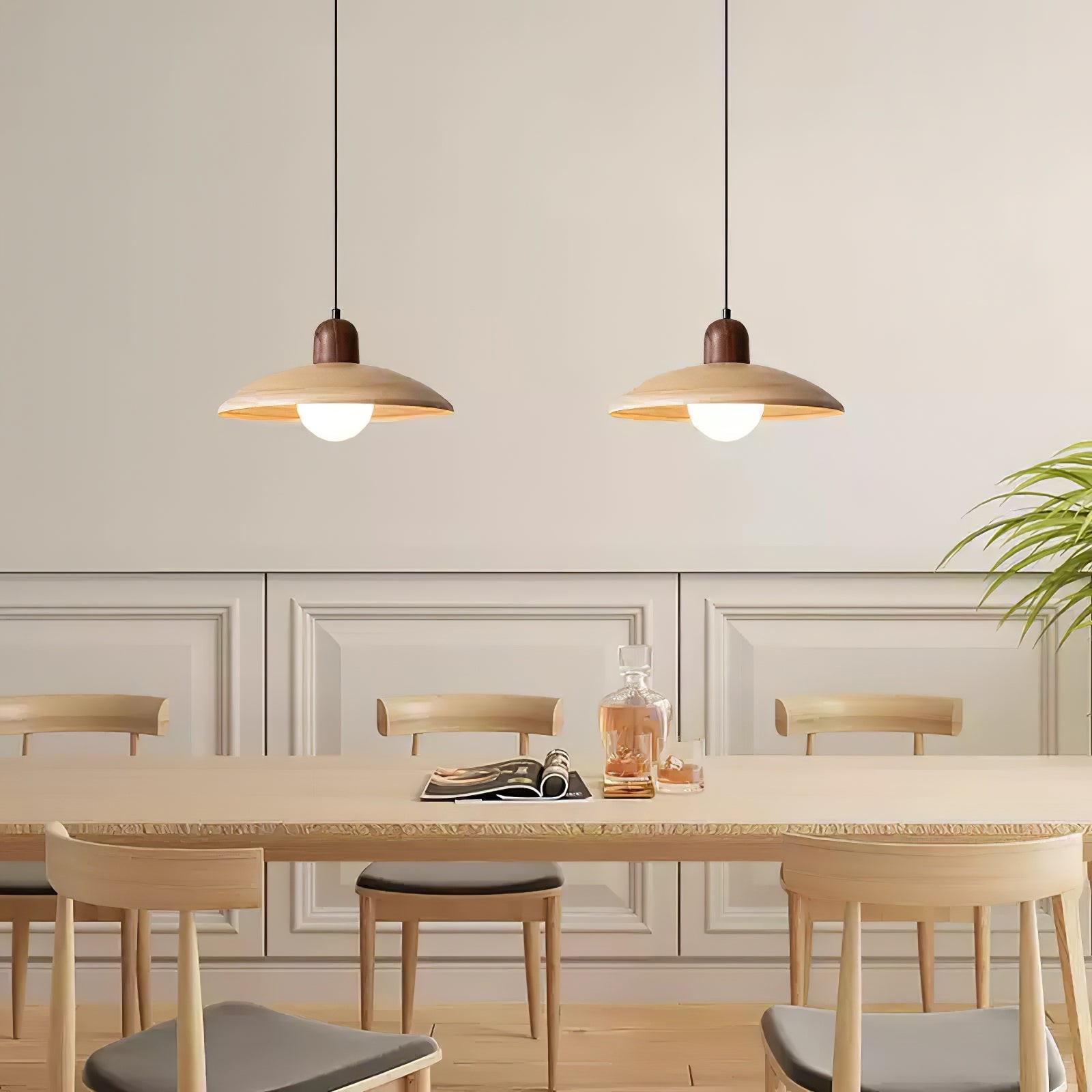 Two pendant lamps above a dining table