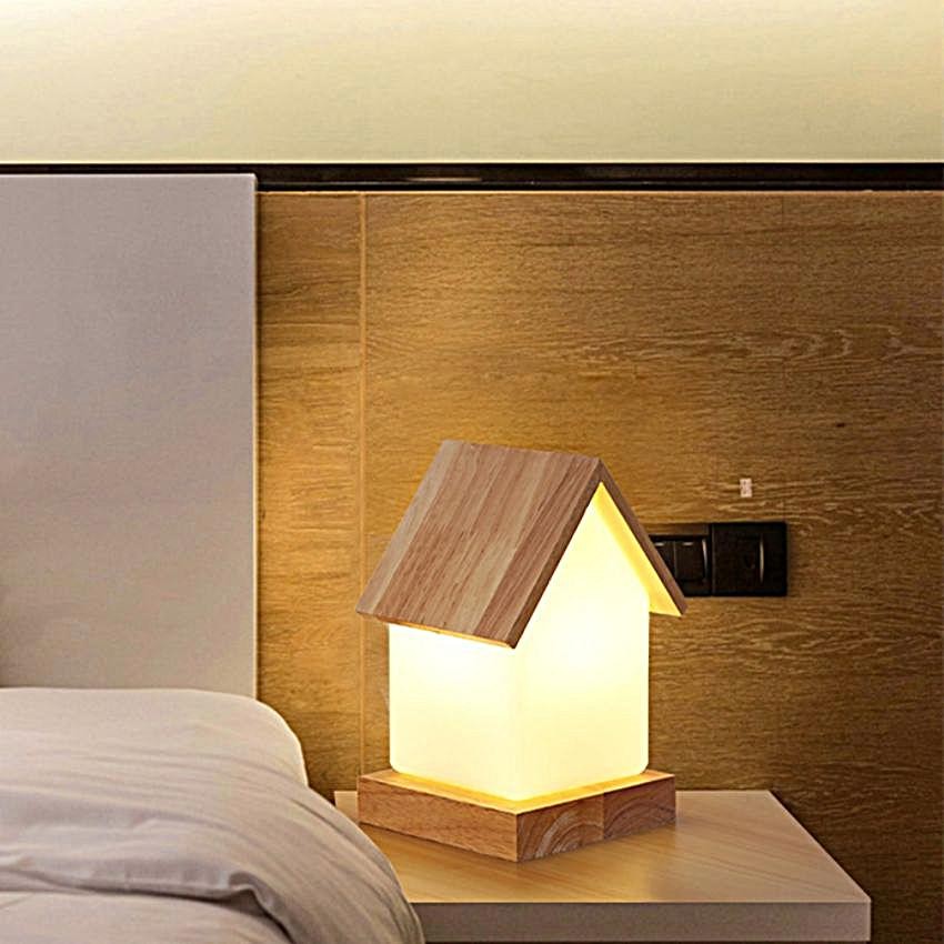 House-shaped COZY LED Table Light on a bedside table