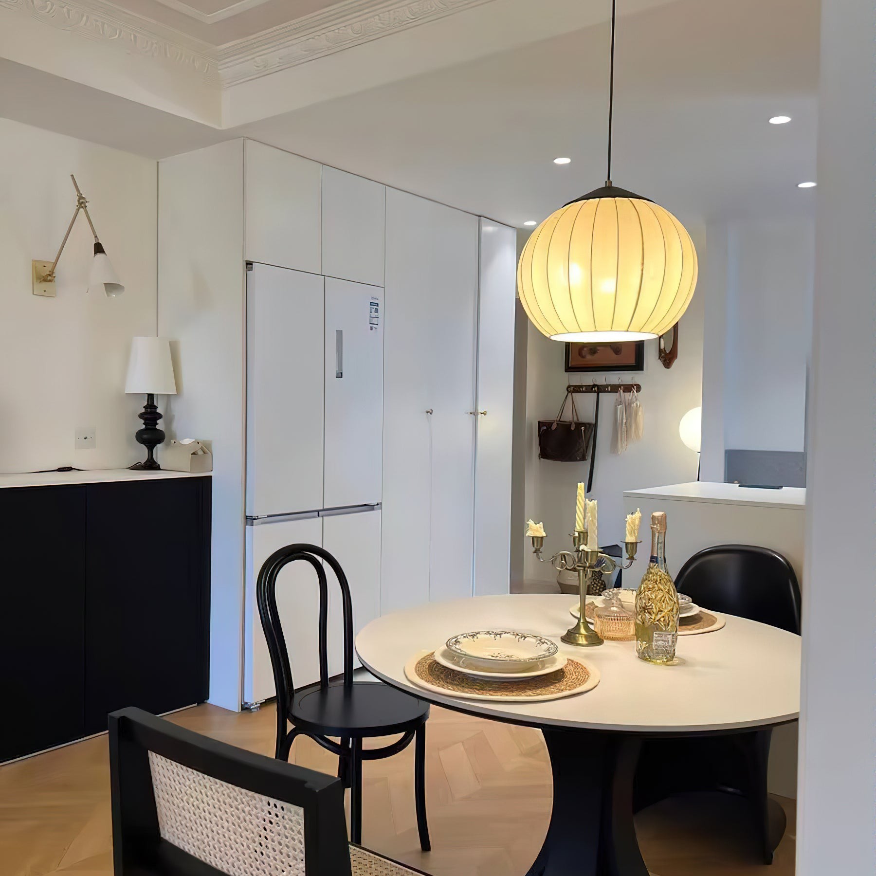 Fabric lantern pendant over a dining and kitchen table