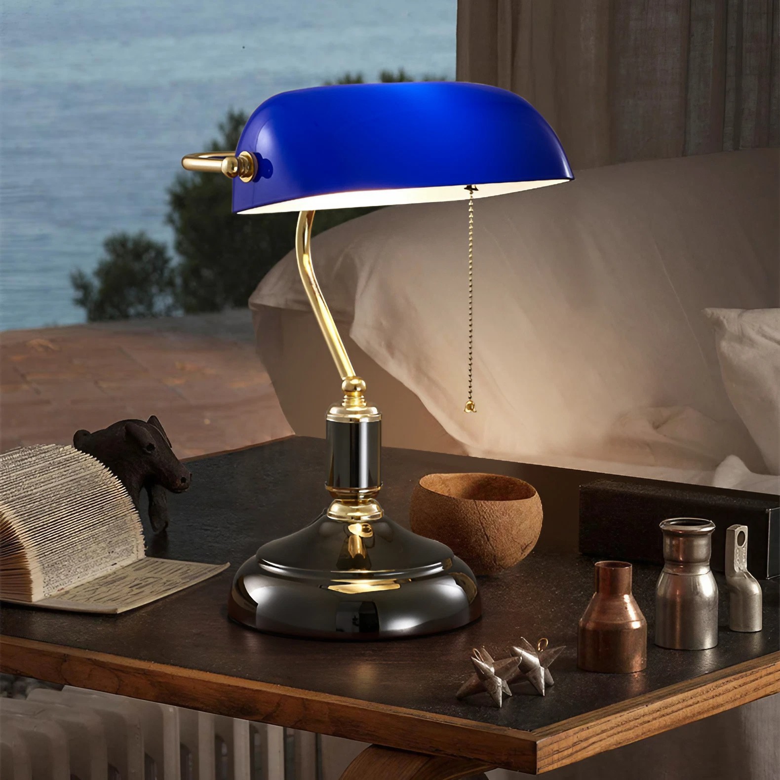 Blue banker lamp displayed on a bedside or desk surface