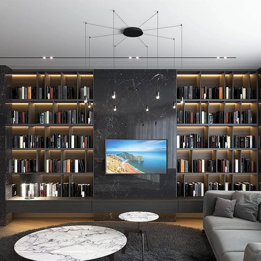 Lampa wisząca Wireflow zainstalowana w obszarze multimediów w salonie