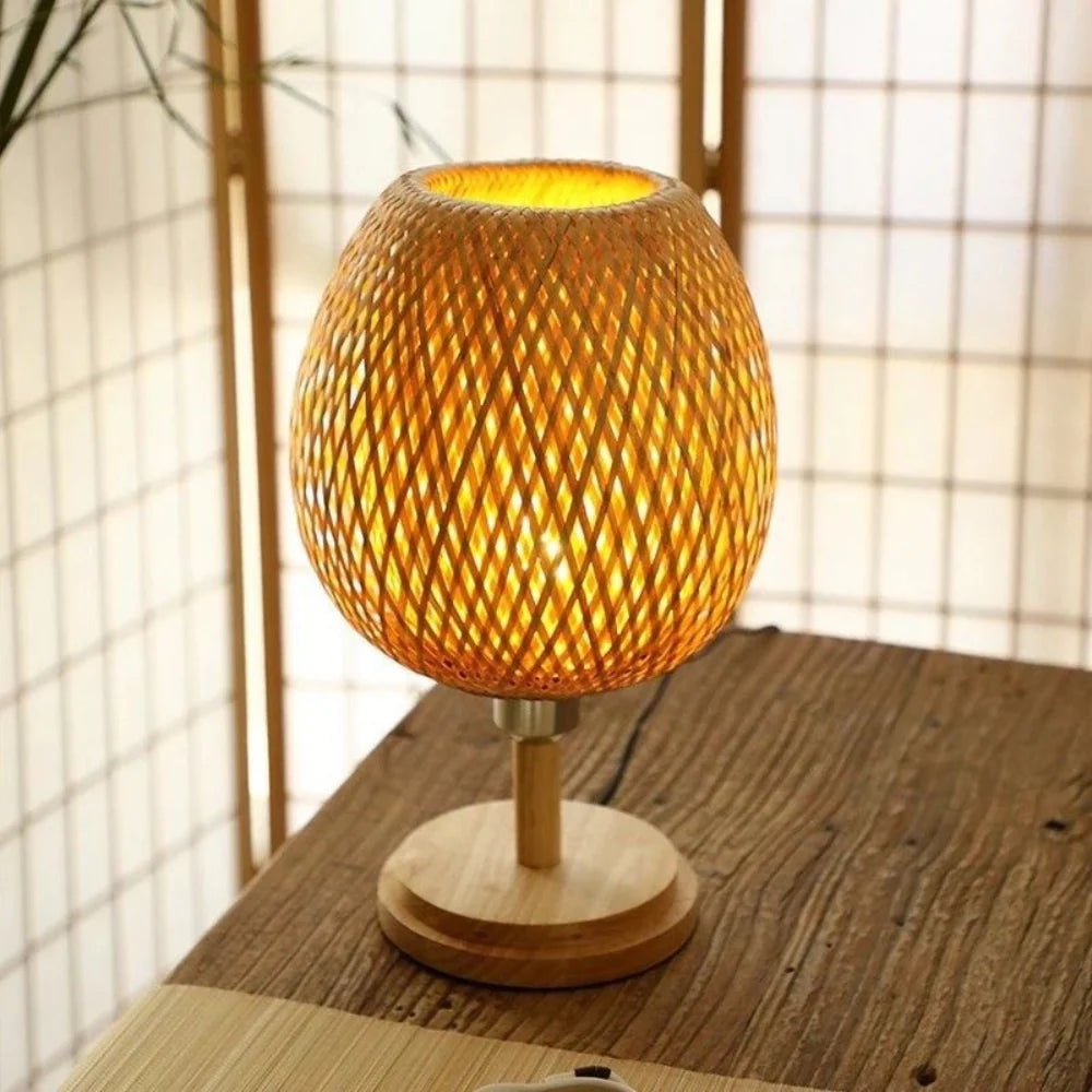 Lit bamboo lamp in front of a shoji-style screen