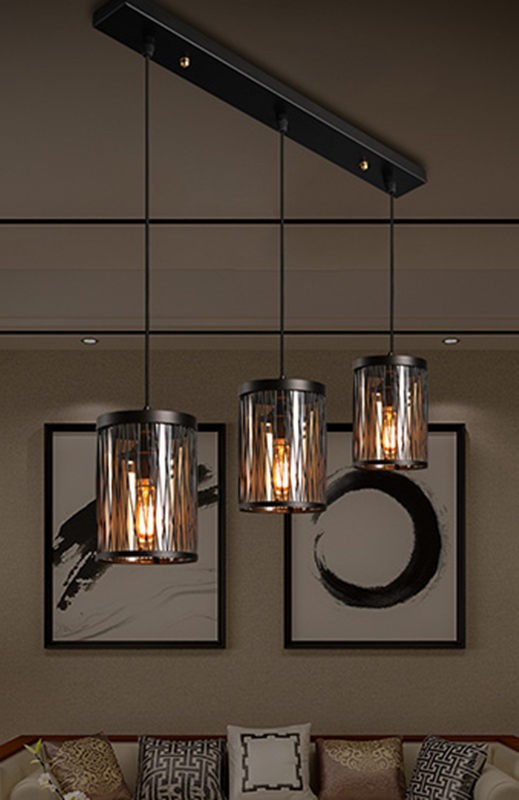 NETTENY caged pendant lights in a darker living room scene