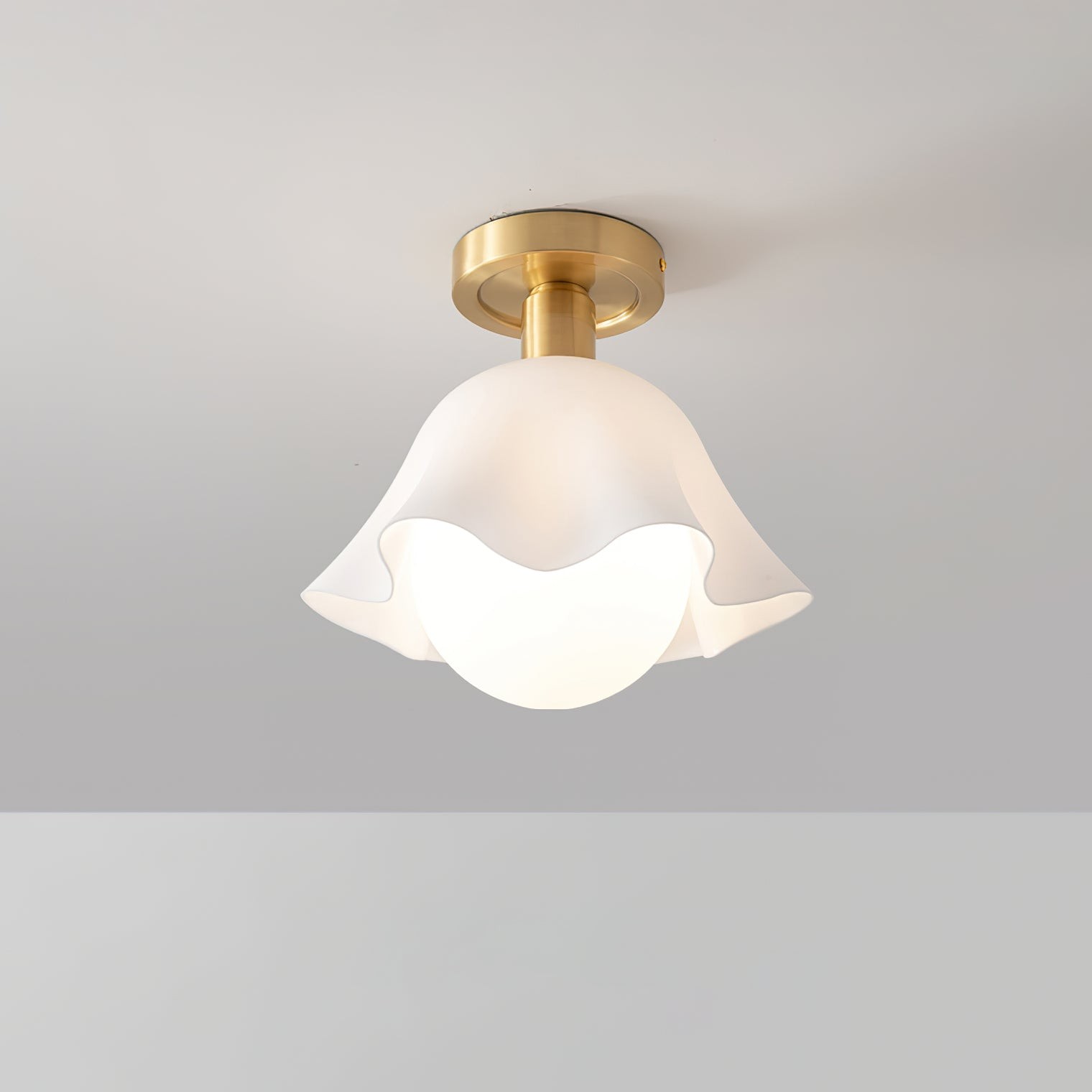 Close view of French Flower Ceiling Light showing the flower shade and brass mount