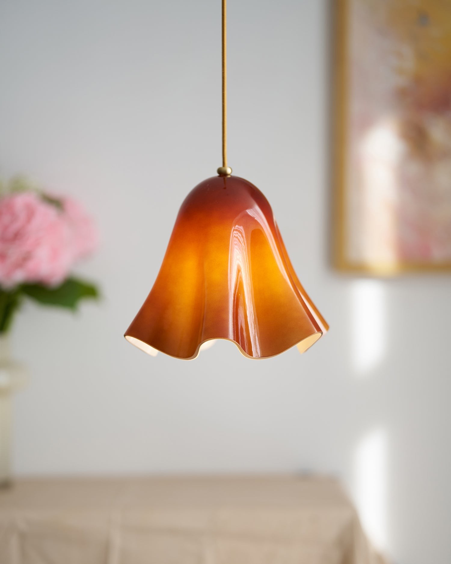 Amber French Skirt Pendant Lamp in a softly blurred room