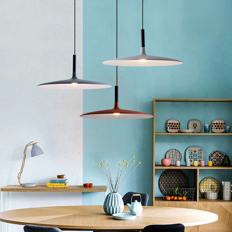 Cone pendant lights in a kitchen and dining room scene