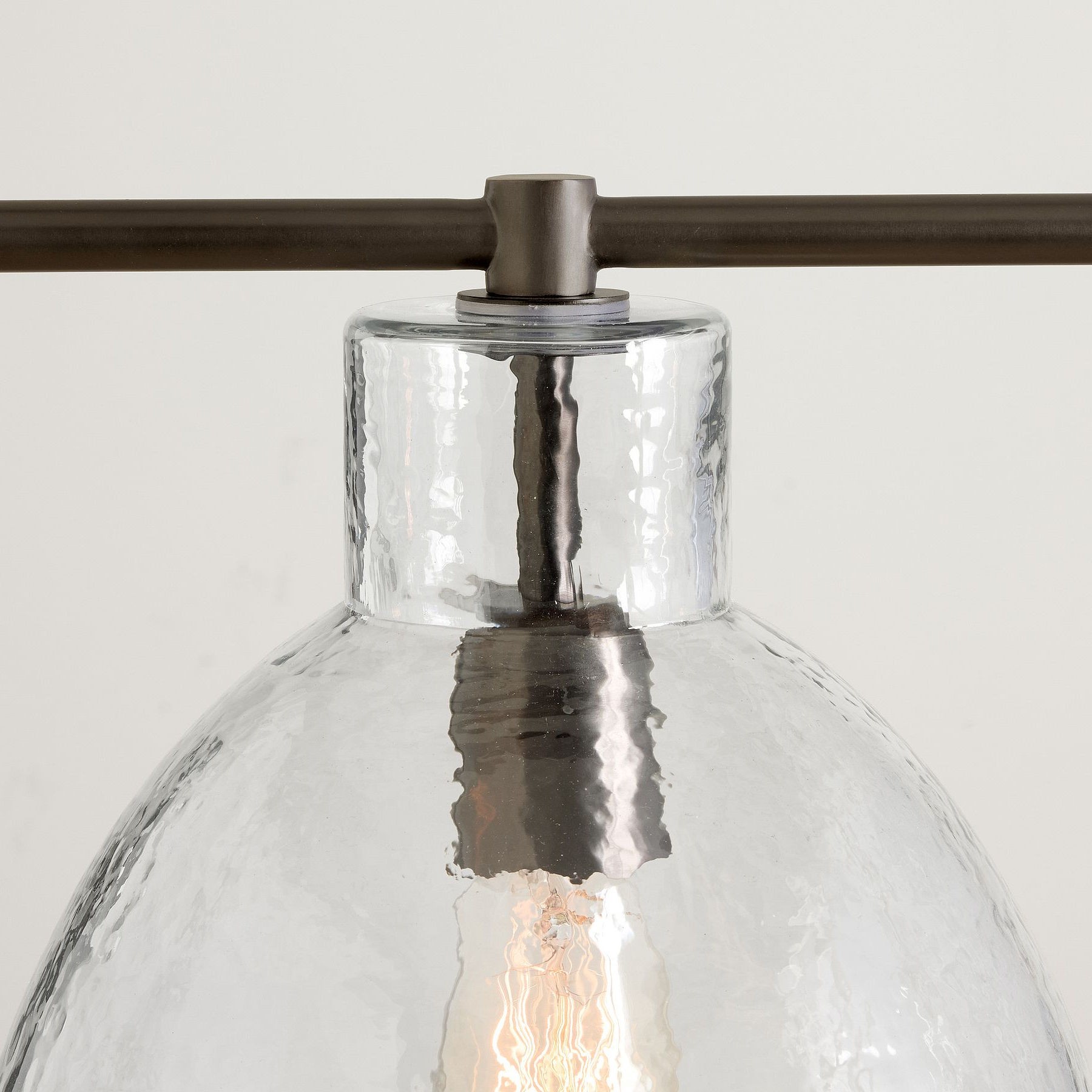 Bronze finish and clear recycled glass shade detail