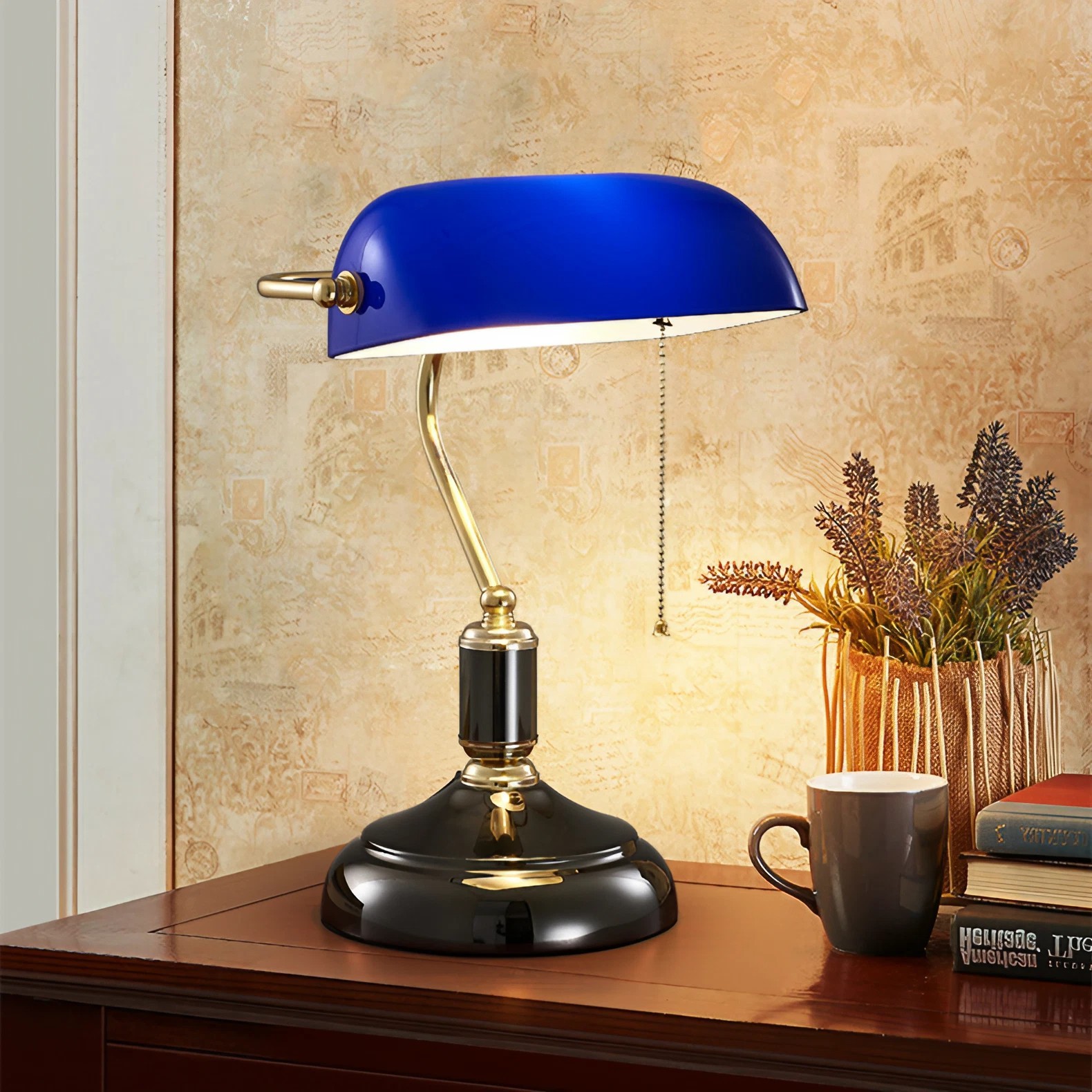 Blue banker lamp displayed on a warm room desk