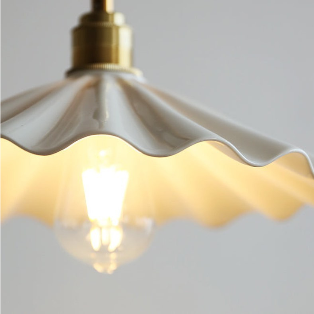 Close-up of the fluted ceramic shade and bulb area of The Ceramic Flute Pendant Lamp D874
