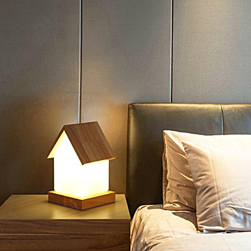 COZY LED Table Light on a bedside table