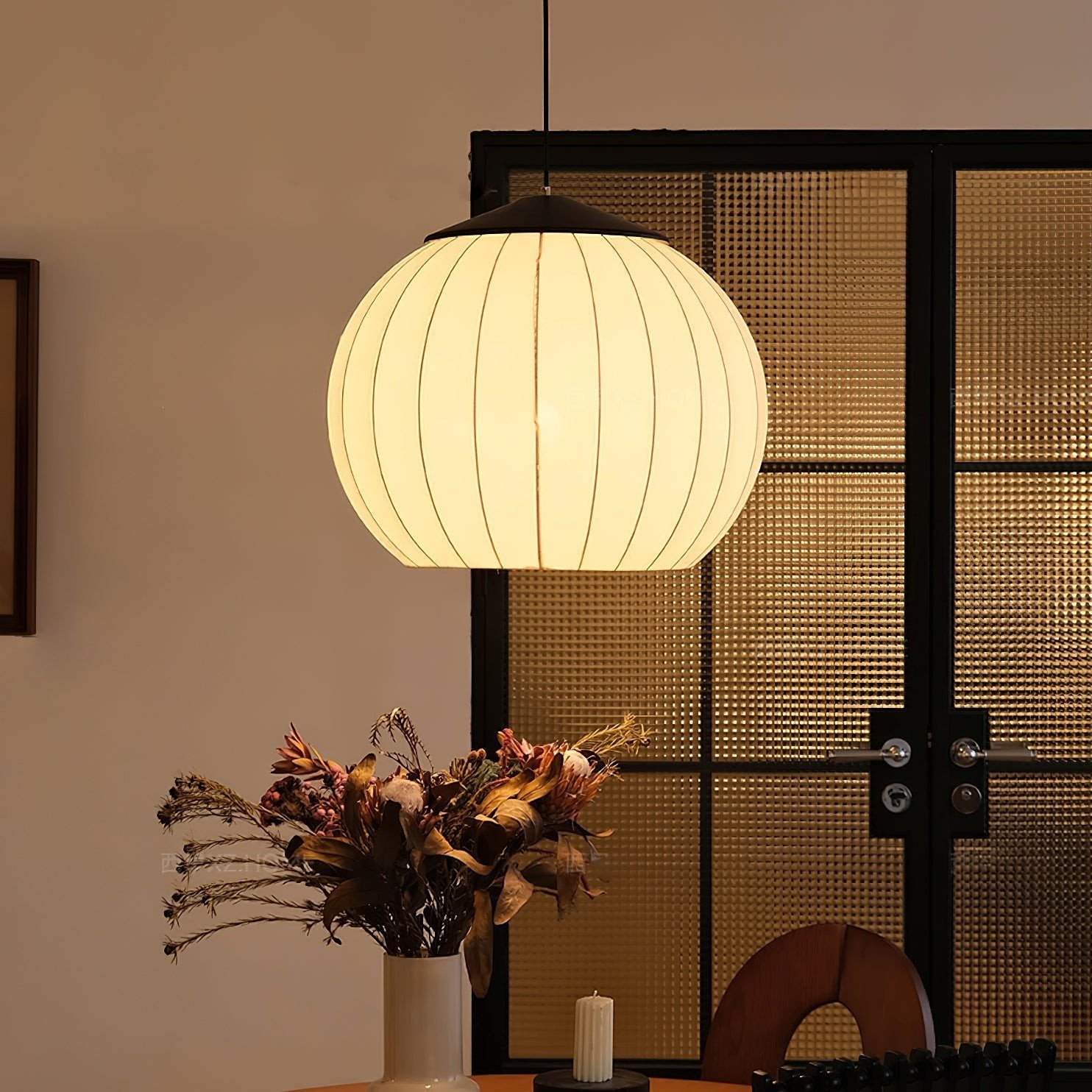 Fabric lantern pendant lamp glowing in a dining and living scene