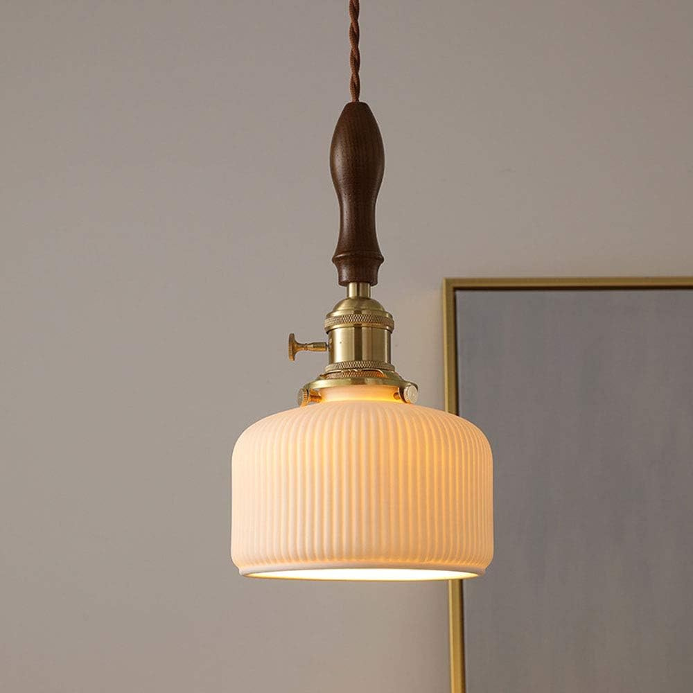 The Smooth Ceramic Pendant Lamp D863 lit in an interior scene