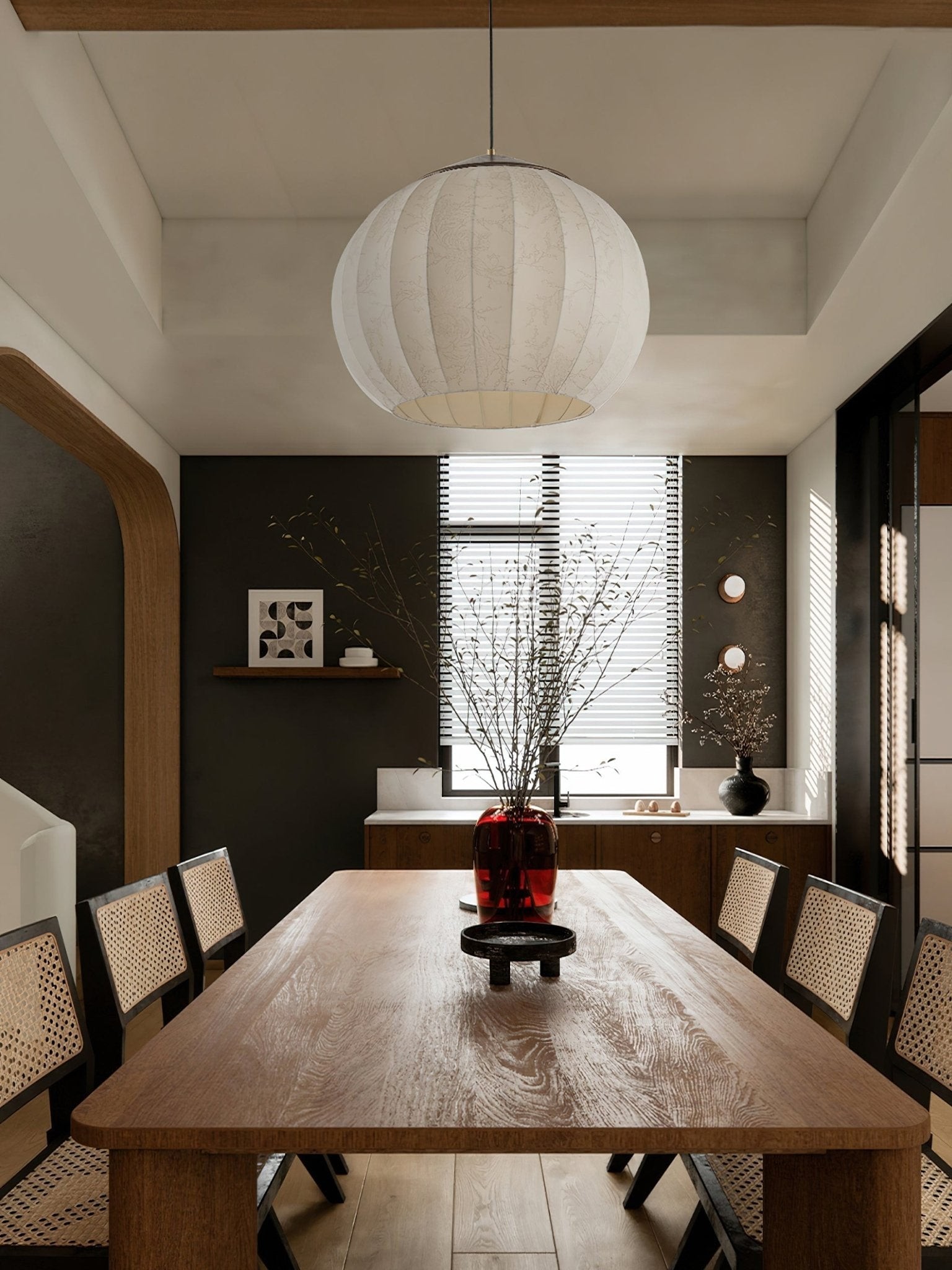 White fabric lantern pendant above a dining table